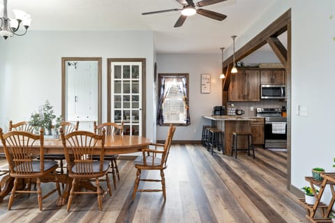 Inviting dining area with rustic charm, seamlessly connected to the kitchen, ideal for entertaining and creating lasting memories.