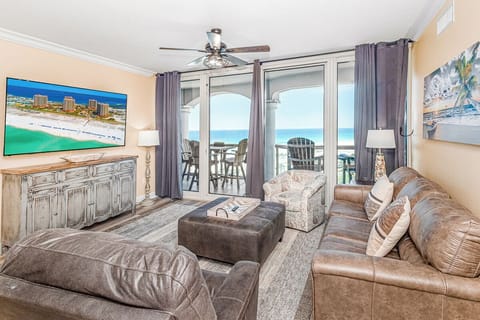 Sink into plush leather seating while watching the waves through your private balcony doors—beach views and coastal breezes await.