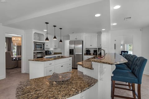 Kitchen with island and breakfast bar