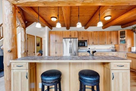 Kitchen island with bar-top seating.
