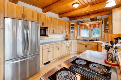 Spacious kitchen with cooktop, oven, coffee maker, microwave, and more.