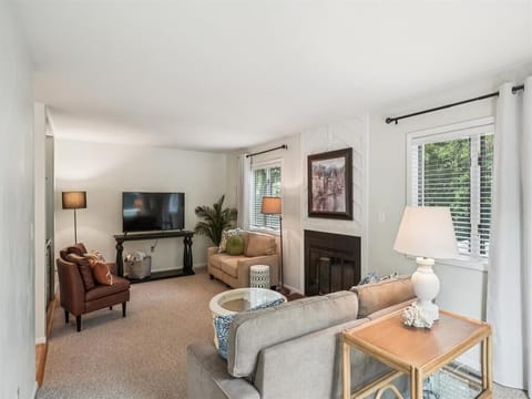 Comfortable living room with plush seating and smart TV for relaxing evenings in.