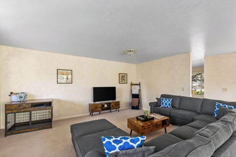 Living room with smart Tv, wifi, and a huge couch