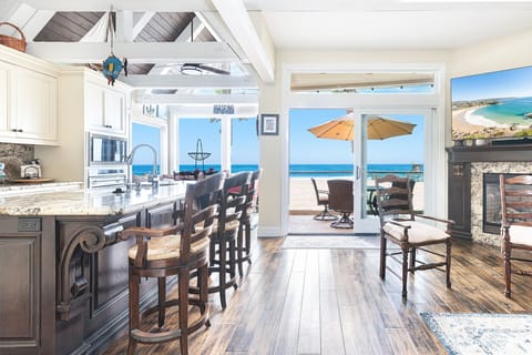 Sunlight pours through expansive oceanfront windows, enjoy front-row views of the Pacific
                