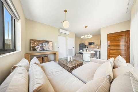 Seamless open-concept living at its finest. Flow effortlessly from the cozy, modern lounge area into a chic dining space and fully equipped gourmet kitchen. Designed for effortless modern lifestyles.