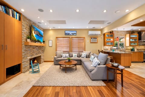 Spacious open-concept living area with comfortable seating and natural flow.