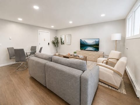 Open-concept living and dining area with comfortable seating.