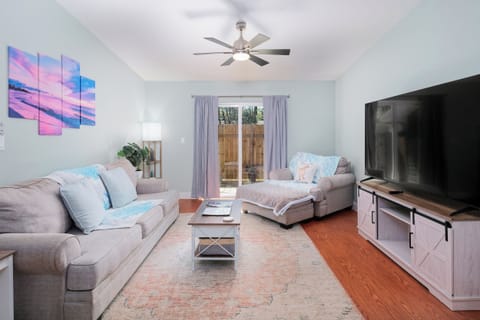 Living Room with convertible sofa bed, lounge chair, and 75" Smart TV