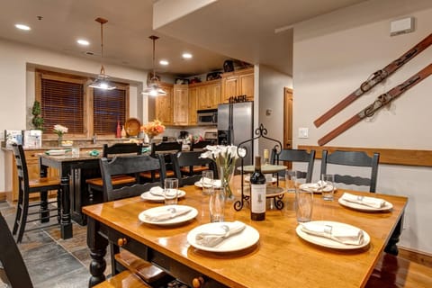 Share meals at your large dining table for eight with ski decor and mountain lodge vibes. PPS-1416