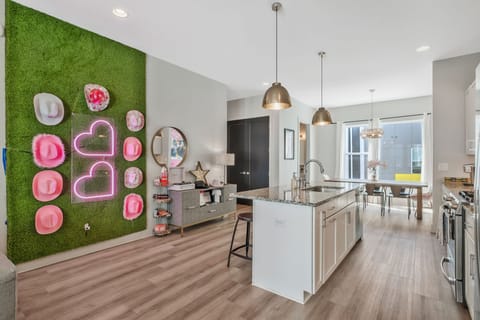 Large Great Room. Living room, dining room, kitchen, games, large TV and guitar.