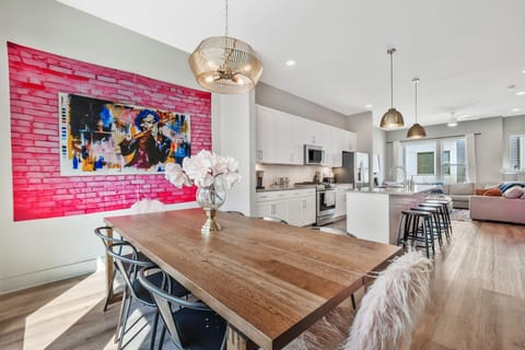 Large dining room table with 12 chairs (8 at table, 4 at counter)