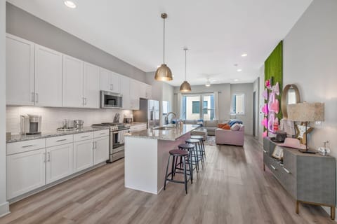 Large Great Room. Living room, dining room, kitchen, games, large TV and guitar.