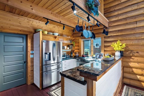Cook together in a chef’s kitchen blending modern style with cabin charm