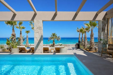 The sublime villa is located directly at the beach (road in between). 