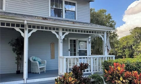 Front of the house, end unit  with a large side yard overlooking the canal.