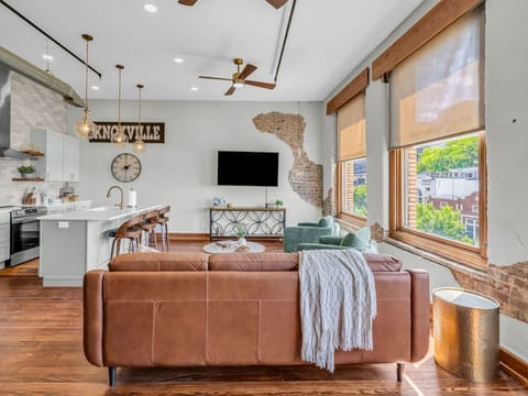 Living Room: Stylish blend of modern charm and historic character, bathed in natural light!