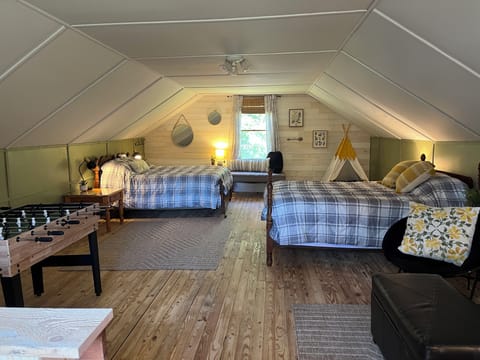 Large loft bedroom upstairs with games, foosball, mini pool table, tee-pee!