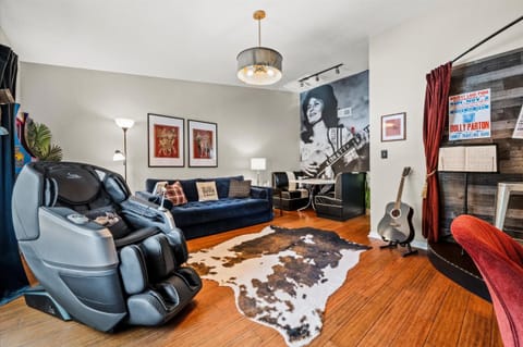 Cozy living room with 4D massage chair and vibrant art ambiance