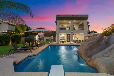 Resort-style pool with rock waterslide