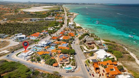Discover the perfect getaway! This stunning aerial view showcases the vibrant beauty of our location, with the beach just a stone`s throw away and endless adventures waiting for you!