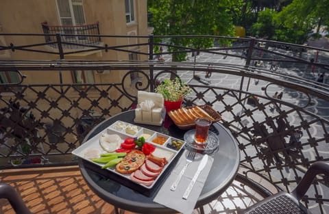Deluxe Triple Room, Balcony, City View | Breakfast meal | Free daily full breakfast