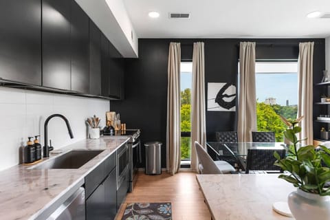 Our kitchen is fully equipped with high-end appliances and two dining areas. Private balcony off of this area to enjoy your morning coffee.