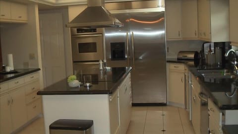 Kitchen - large fridge with double ovens