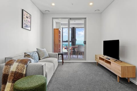 The living room is a cosy place to rest with warm throws and luxe cushions.
