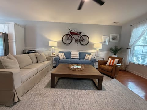 Plenty of seating with 2 full-size sofas and 2 leather chairs.