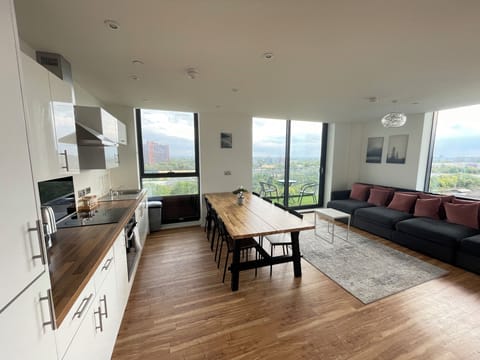 Cozy living room with open plan kitchen and dining area