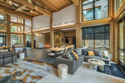 Spacious communal area with seating areas and large windows.
