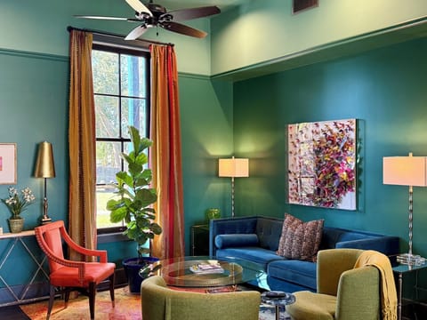 Spacious living room with 12-foot ceilings and abundant natural light.