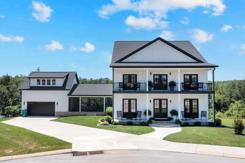 Stunning exterior with balconies, lush greenery, and ample space to unwind!