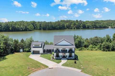 Stunning lake views await! Relax on the porch and soak in nature's beauty.