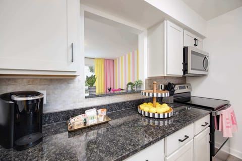 Kitchen: Whip up culinary delights in this vibrant, stylish kitchen with modern appliances!