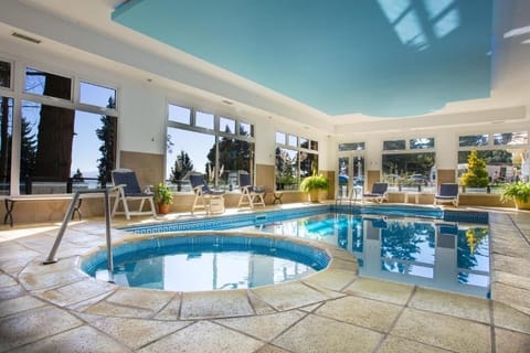 Unwind with sunlit laps in this serene indoor pool.