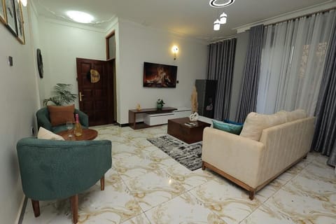 Comfort Apartment, City View | Living area | 58-inch Smart TV with cable channels