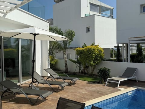 Pool area with access to kitchen and living room