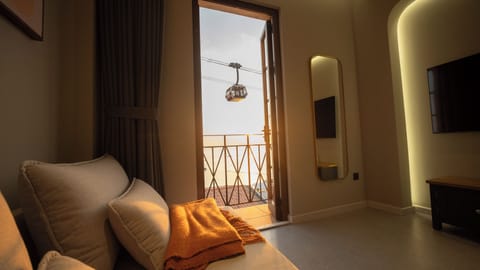 Luxury Suite, 1 King Bed with Sofa bed, Balcony, Beach View | Living area | 55-inch Smart TV with digital channels