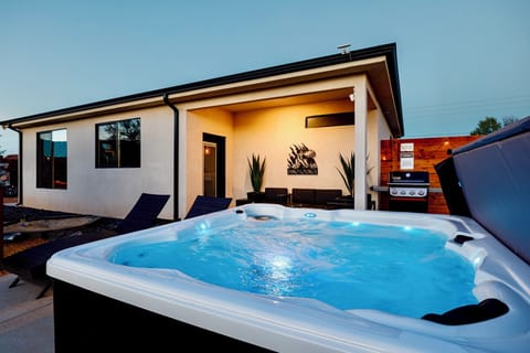 Soak in the private hot tub while enjoying desert and mountain views
