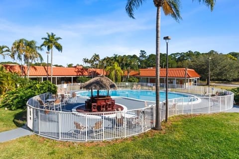 Soak up sunshine by the resort-style pool and palms.