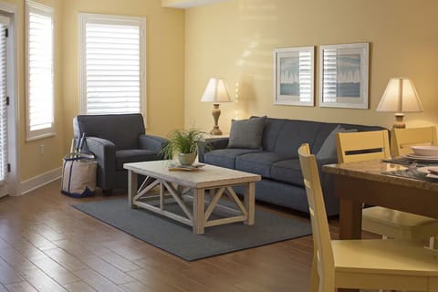 Lounge together on plush seating in sunlit comfort.