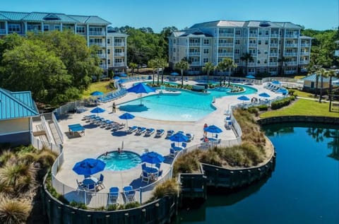 Dive into a resort-style pool oasis with endless loungers.