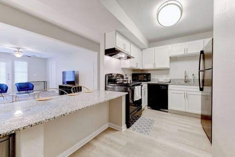 Modern kitchen w/ breakfast bar and sleek finishes