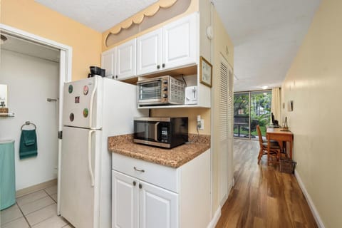 Efficient kitchen setup with basic appliances and utensils — perfect for quick meals during a laid-back stay.