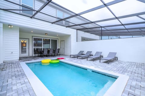 Enjoy a refreshing swim or gather at the poolside dining table for drinks and outdoor meals