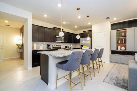 Modern Kitchen Area with Centred Island and Bar Seating
