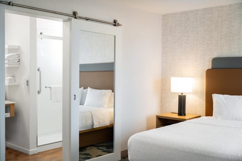 Desk, laptop workspace, blackout drapes, iron/ironing board