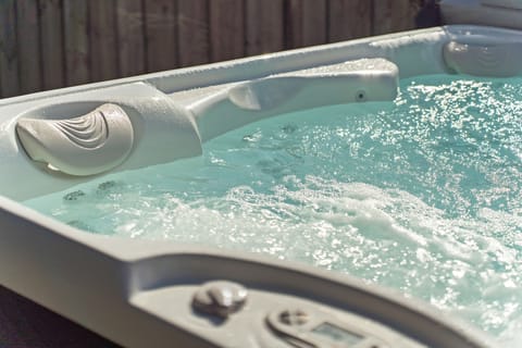 Unwind in our brand-new saltwater spa and relax after a day at Crescent Beach.