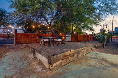 Backyard with raised dining area and grill (Note: Backyard is shared with front house owners)